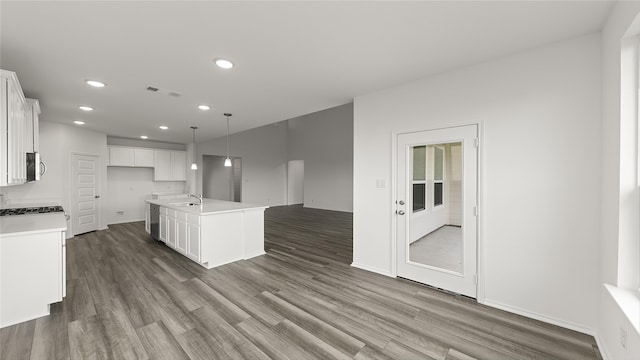 unfurnished living room featuring dark hardwood / wood-style floors and high vaulted ceiling