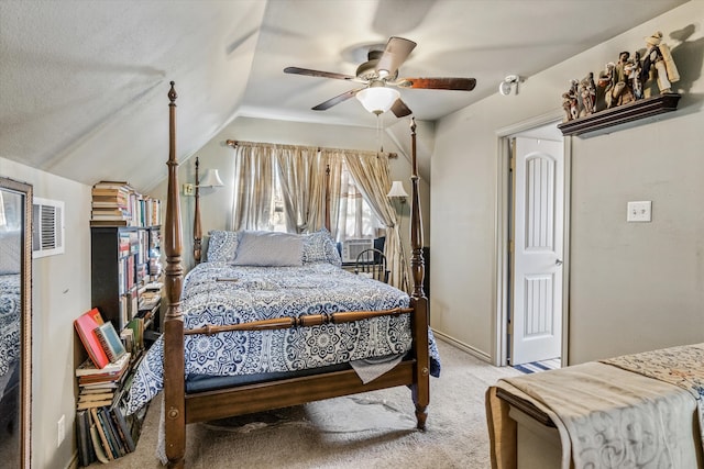 carpeted bedroom with ceiling fan and vaulted ceiling