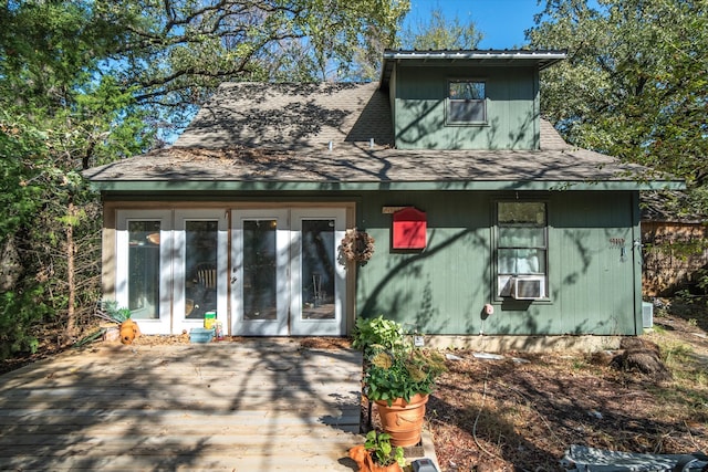 rear view of property featuring french doors