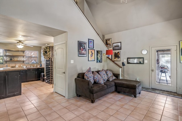 living room with light tile patterned floors and ceiling fan