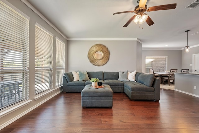 living room with ceiling fan, crown molding, and dark hardwood / wood-style flooring