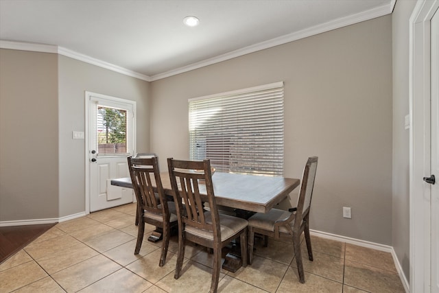 tiled dining room with crown molding