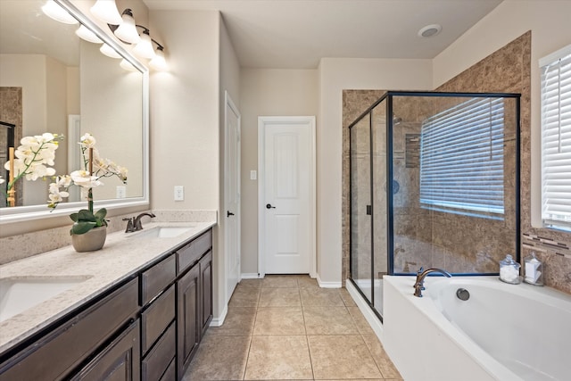 bathroom featuring vanity, shower with separate bathtub, and tile patterned floors