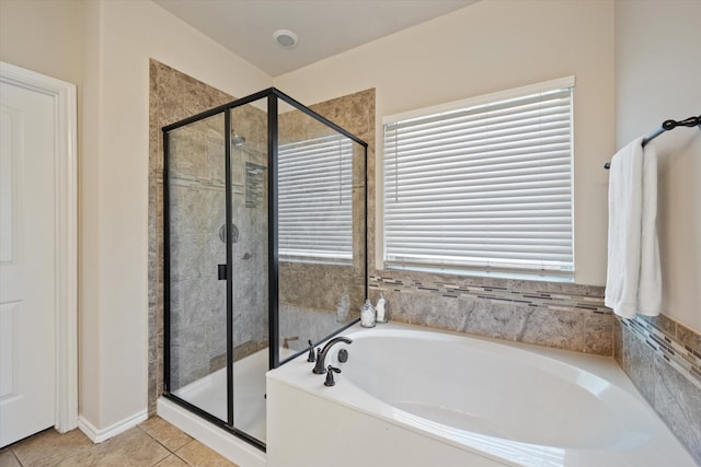 bathroom featuring tile patterned flooring and independent shower and bath