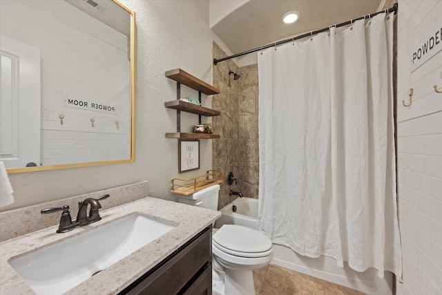 full bathroom with shower / bath combo, vanity, toilet, and tile patterned floors