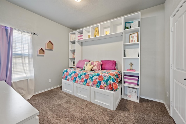 carpeted bedroom featuring a textured ceiling