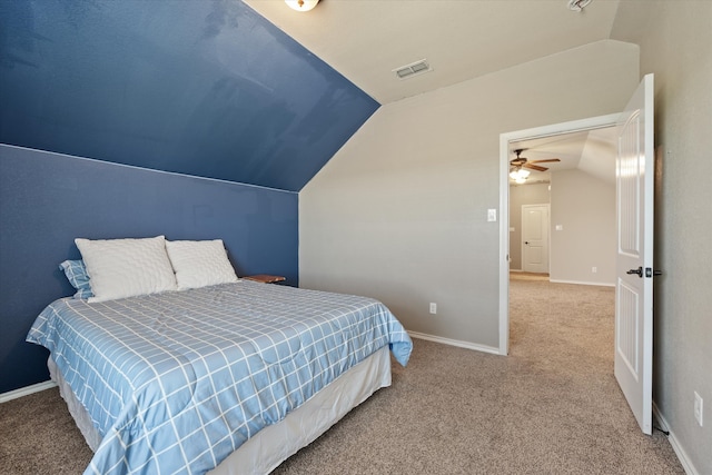 carpeted bedroom with vaulted ceiling