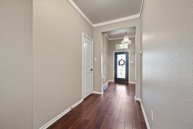 doorway featuring crown molding and dark wood-type flooring