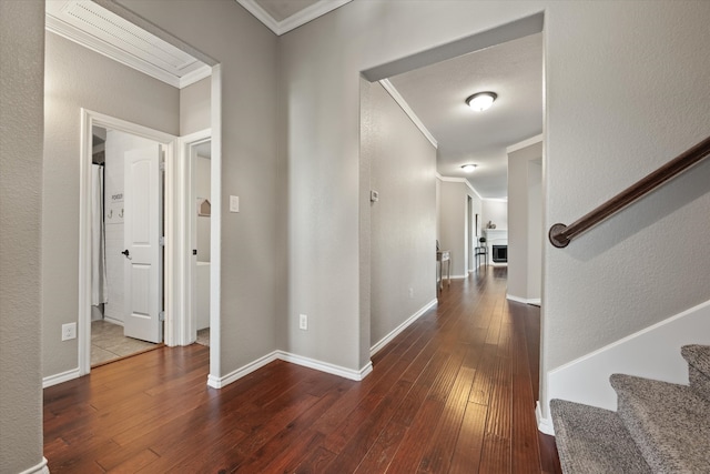 hall featuring wood-type flooring and ornamental molding