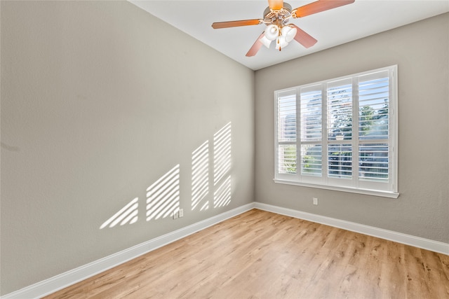 empty room featuring light wood-type flooring and ceiling fan