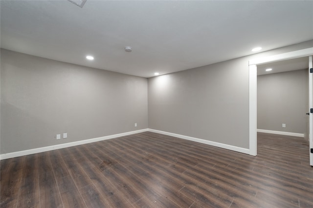 empty room featuring dark hardwood / wood-style flooring