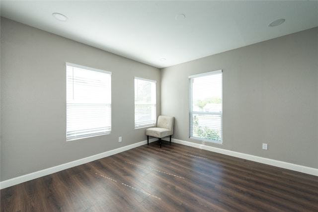 empty room featuring dark hardwood / wood-style floors