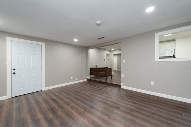 interior space with dark hardwood / wood-style flooring