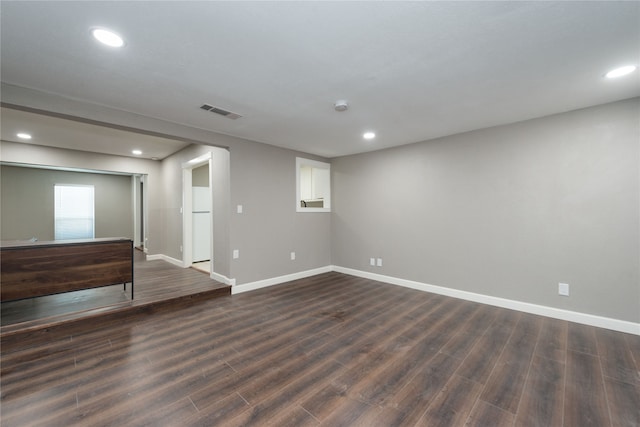 unfurnished room featuring dark hardwood / wood-style flooring