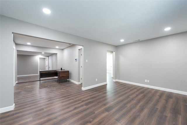 unfurnished room featuring dark hardwood / wood-style flooring