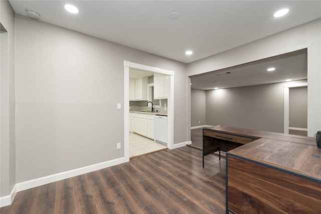 office area featuring light wood-type flooring and sink