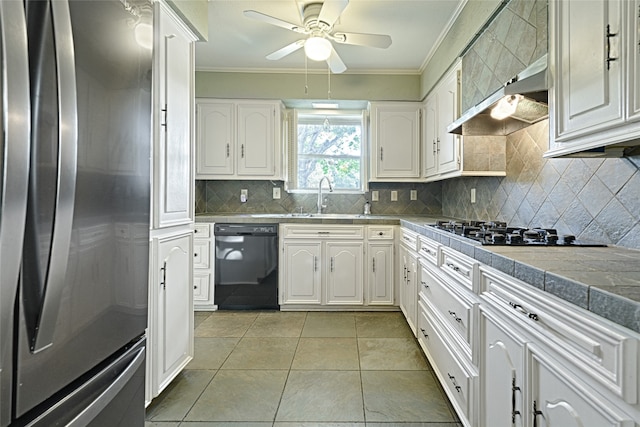 kitchen featuring black appliances, white cabinetry, and crown molding