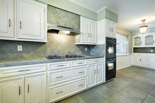 kitchen with decorative backsplash and white cabinetry