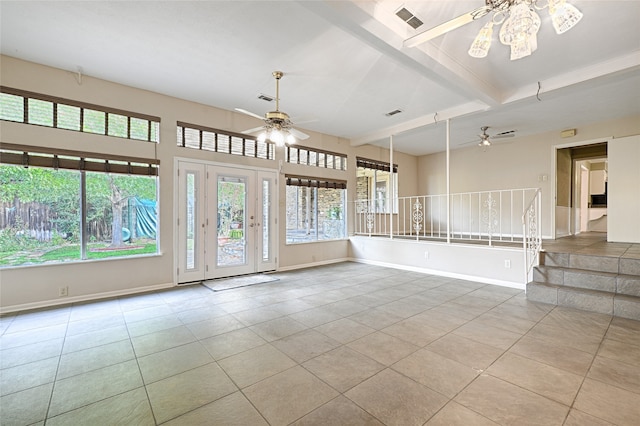 spare room featuring beam ceiling, light tile patterned flooring, and ceiling fan