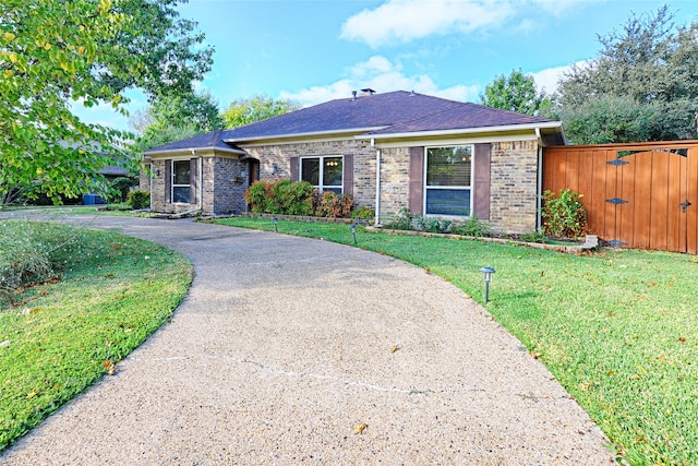 single story home with a front yard