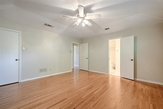 spare room featuring light hardwood / wood-style floors and ceiling fan