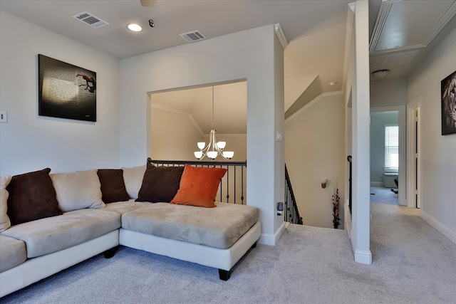 carpeted living room with an inviting chandelier and ornamental molding