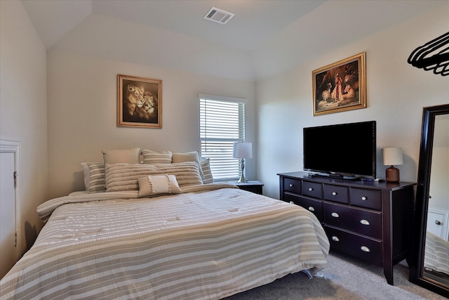 bedroom featuring carpet floors and lofted ceiling