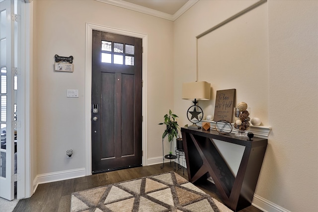 foyer featuring crown molding and dark hardwood / wood-style flooring