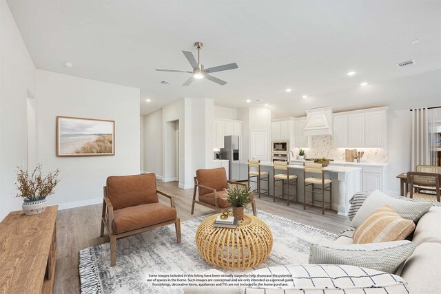 kitchen with appliances with stainless steel finishes, a center island with sink, and sink