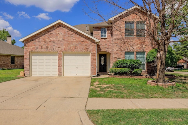 traditional-style home featuring a front lawn, driveway, a garage, and brick siding