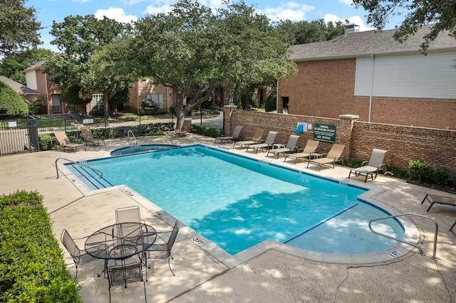 view of swimming pool featuring a patio