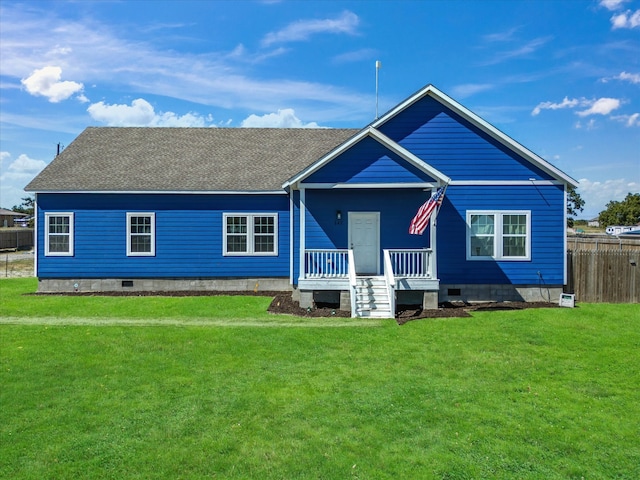 rear view of property with a yard