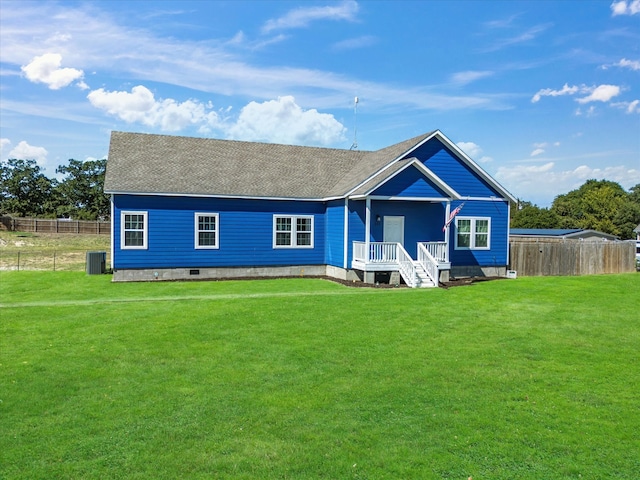 rear view of property with a yard and central air condition unit