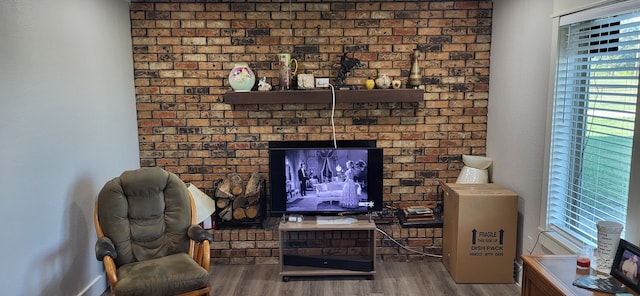 sitting room with hardwood / wood-style flooring