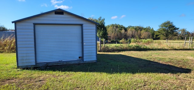 garage with a yard