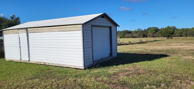 view of outdoor structure featuring a yard