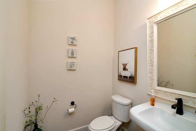 bathroom featuring sink and toilet