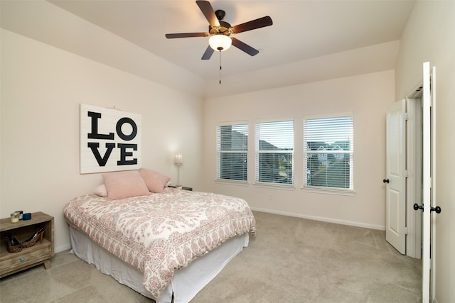 bedroom featuring light carpet and ceiling fan