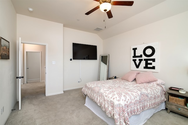 carpeted bedroom with vaulted ceiling and ceiling fan