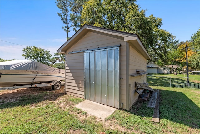 view of outdoor structure featuring a yard