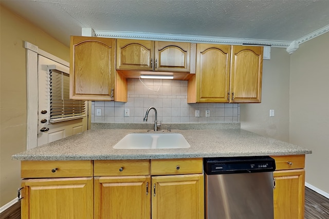 kitchen with dishwasher, sink, dark wood-type flooring, backsplash, and ornamental molding