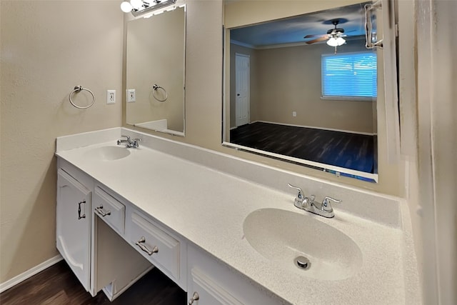 bathroom featuring hardwood / wood-style floors, vanity, ceiling fan, and crown molding