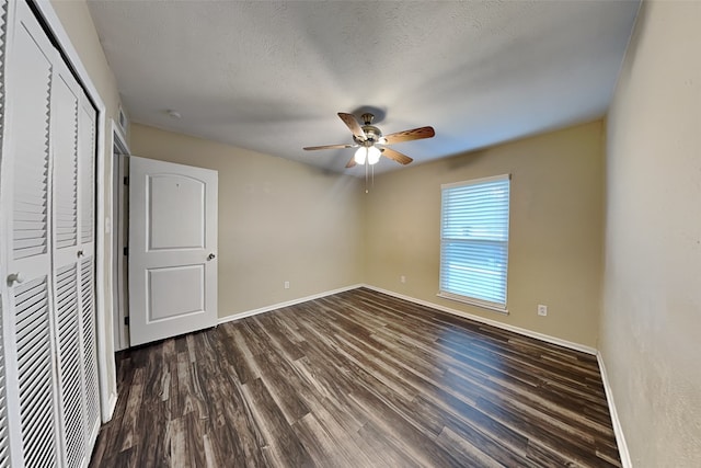 unfurnished bedroom featuring ceiling fan, wood-type flooring, and a textured ceiling