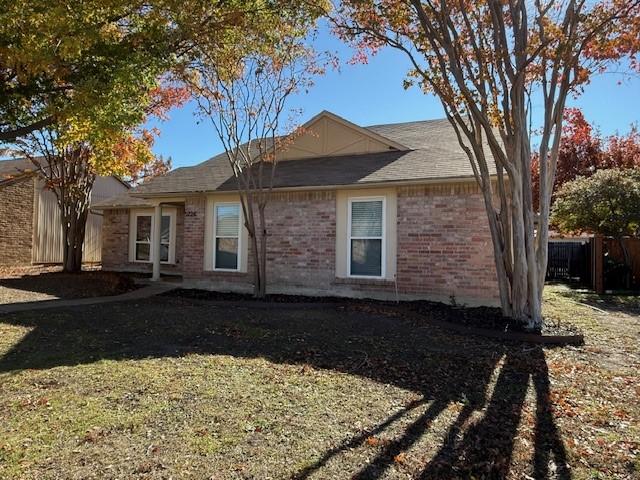 view of side of property with a yard