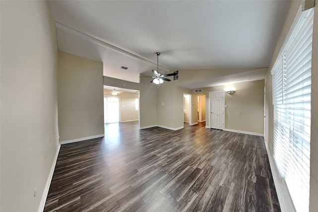 spare room featuring ceiling fan, dark hardwood / wood-style floors, and vaulted ceiling