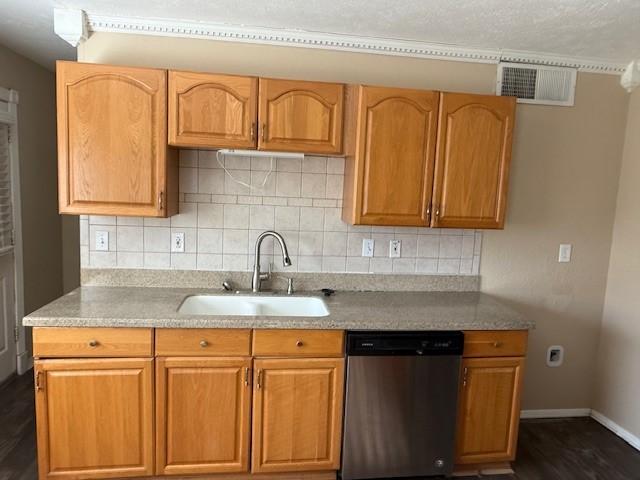 kitchen featuring decorative backsplash, dishwasher, dark hardwood / wood-style floors, and sink