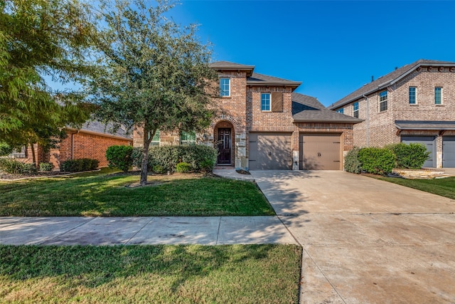 view of front of house featuring a garage and a front yard