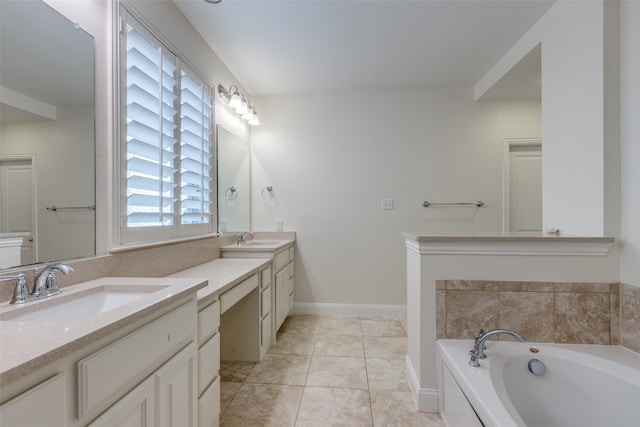 bathroom with vanity, a bathing tub, and tile patterned flooring