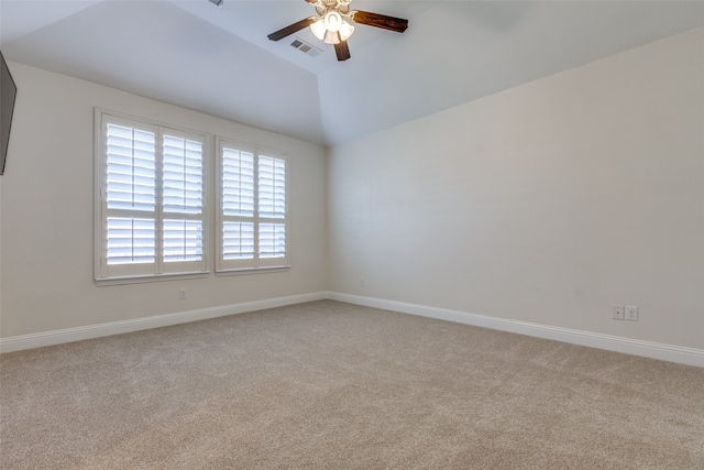 unfurnished room with lofted ceiling, ceiling fan, and light colored carpet