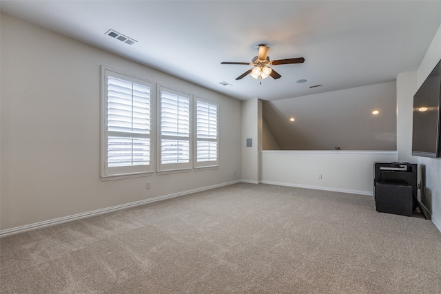 bonus room featuring light carpet, vaulted ceiling, and ceiling fan